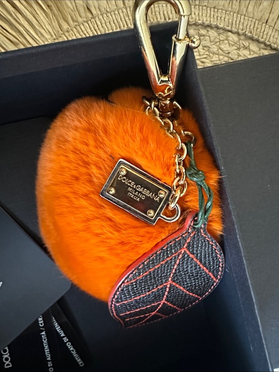 Dolce & Gabbana Handbags - Dolce & Gabbana Bright Orange Fur Pom with Gold Hardware and Leaf Charm
